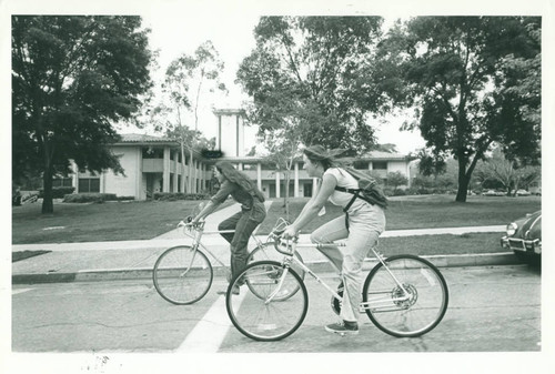 Cycling past Harper East, Claremont Graduate University