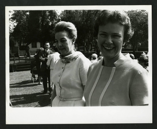 Two women attending the Dedication of Drake Wing celebration, Scripps College