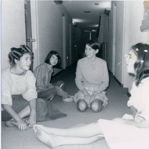 Students talking in a dorm hallway, Pitzer College