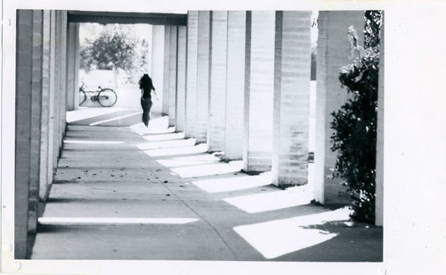 Woman under arcades, Pitzer College