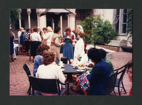 People mingling at Betty Merfeld's retirement party, Scripps College