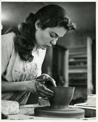 Student at a pottery wheel