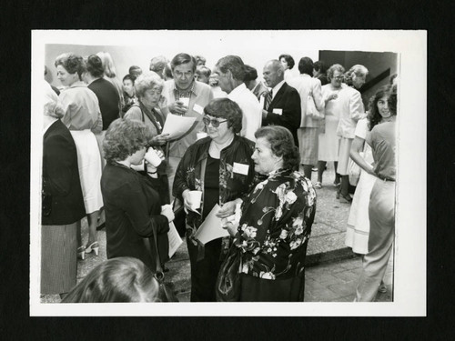 Scripps alumnae smiling and mingling at a reunion celebration, Scripps College