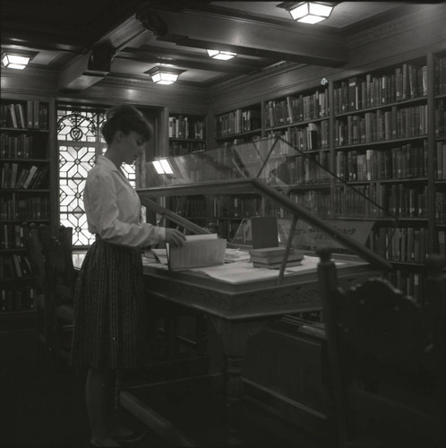 Arranging a Denison Library exhibit, Scripps College