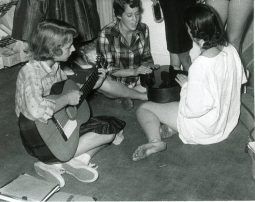 Women playing musical instruments, dormitory room, Pomona College