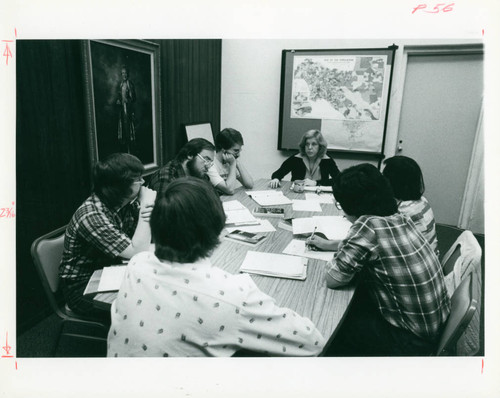 Students gather around a table, Claremont McKenna College