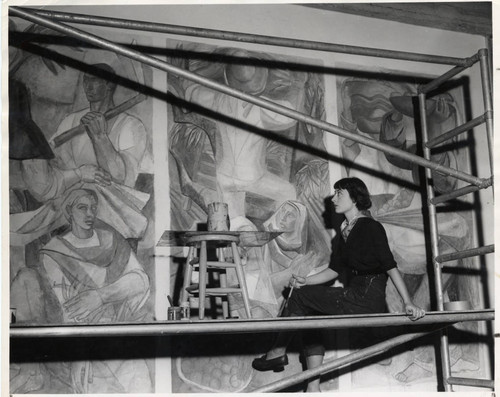 Woman painting mural, Scripps College