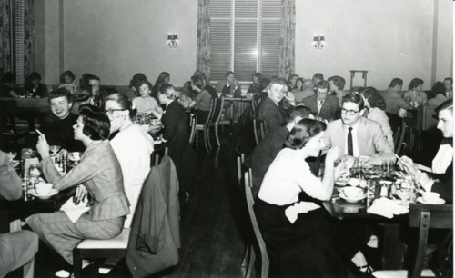Students eating and smoking, dining hall, Pomona College