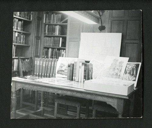 Neatly organized exhibit amongst the bookcases of Denison Library, Scripps College