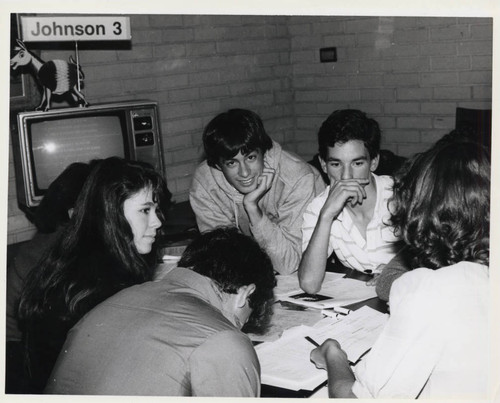 Students sitting around a table, Claremont McKenna College