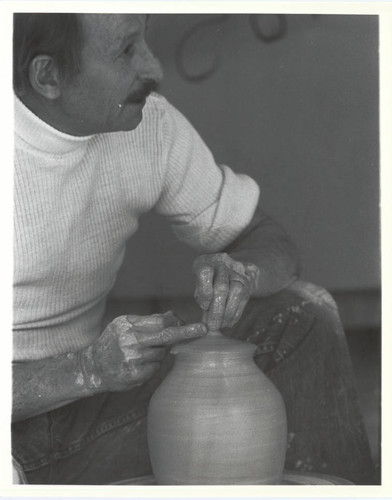 Paul Soldner with pottery wheel, Scripps College