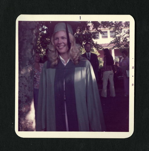 Scripps's Staff Chairman wearing her graduation robe, Scripps College