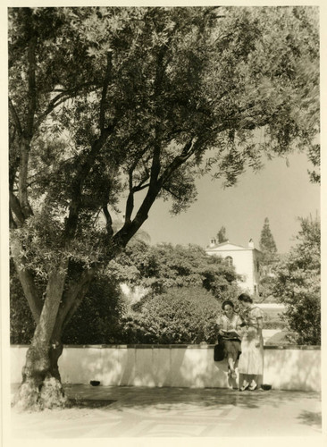 Scripps College students reading a book