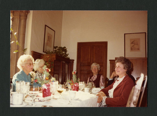 Dorothy Drake eating dinner with colleagues, Scripps College