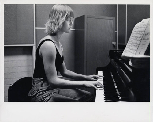 Woman plays piano, Scripps College