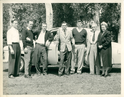 Alumni standing next to a car, Claremont McKenna College