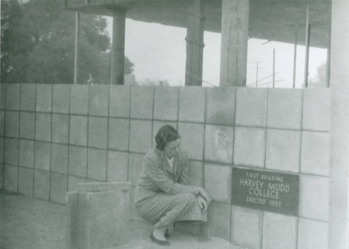 Jean Platt next to the cornerstone of Mildred E. Mudd Hall, Harvey Mudd College