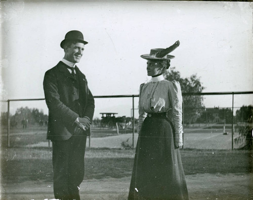 Students next to tennis courts, Pomona College