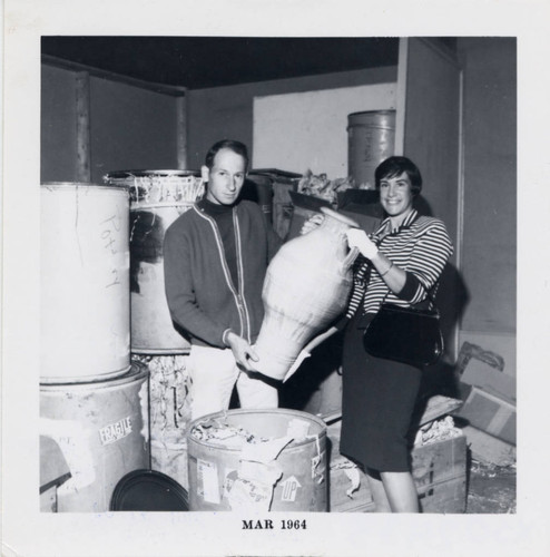 Professor and student with large jug, Scripps College