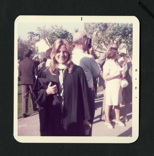 Scripps College student smilling after graduating, Scripps College