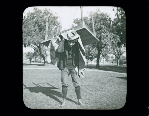 Student with table on his back, Pomona College