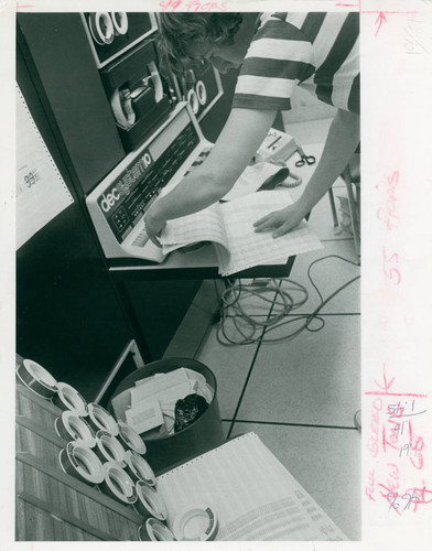 An individual stands in front of a decsystem10, Claremont McKenna College