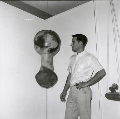 Man with ceramic hanging, Scripps College