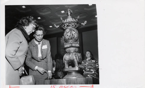 Two women observe a sculpture, Scripps College