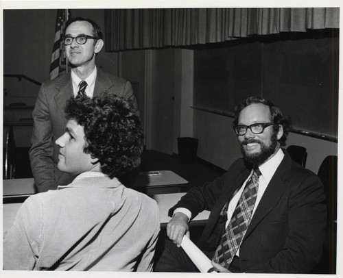 C. Fred Bergsten sitting with two men, Claremont McKenna College