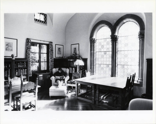 Student reading in Denison Library, Scripps College