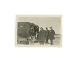 Director J. Gordon Edwards with a woman and two men next to a car