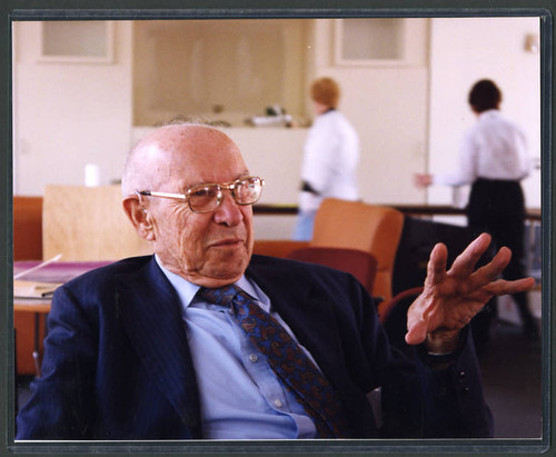 Photograph by Deepak Shimkhada of Peter Drucker sitting in a chair