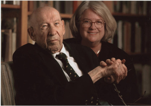 Peter Drucker seated next to an individual