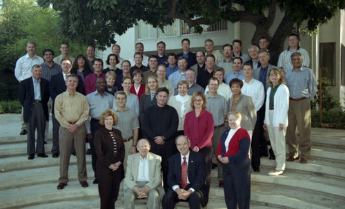 Peter Drucker sitting with a group of people