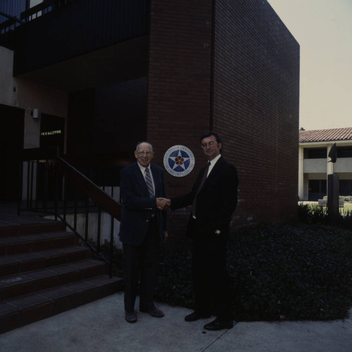 Peter Drucker standing outside Stauffer Hall