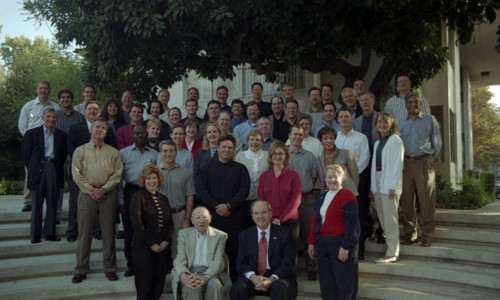 Peter Drucker sitting with a group of people