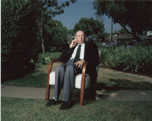 Peter Drucker seated outside