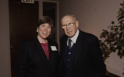 Peter Drucker standing next to Hilary Barr