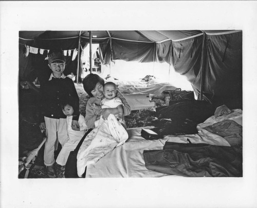 Woman and children in tent print