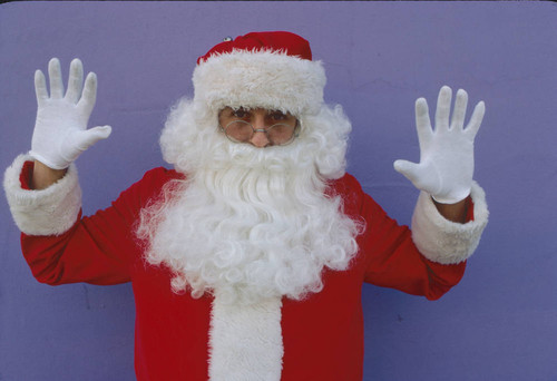 Santa Claus at purple wall