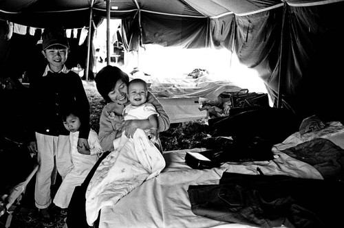 Woman and children in tent