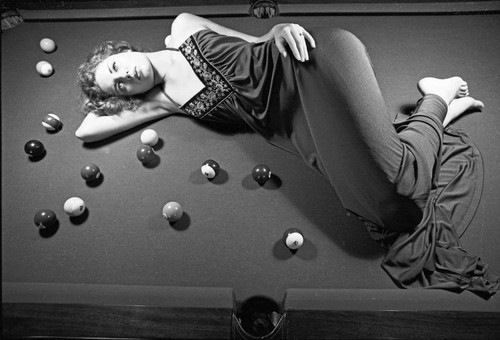 Model on billiard table