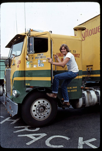 Yellow truck and trucker