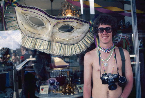 Tourist with camera and beads