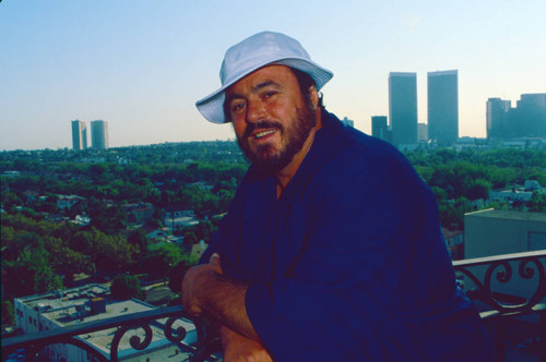 Luciano Pavarotti on hotel balcony