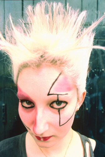 Punk face makeup and spiked hair