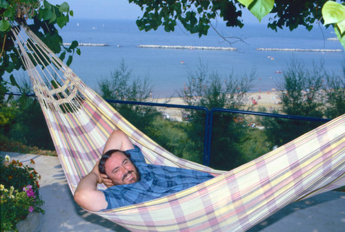 Luciano Pavarotti in hammock