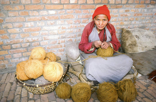 Woman working with sheep thread