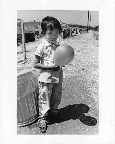 Child holding balloon print