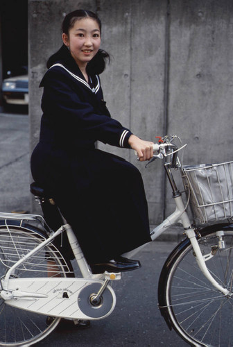 Teenager with bicycle